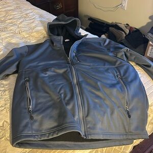 Large NWOT gray weatherproof jacket with hood 3 zipper pockets zipper closure